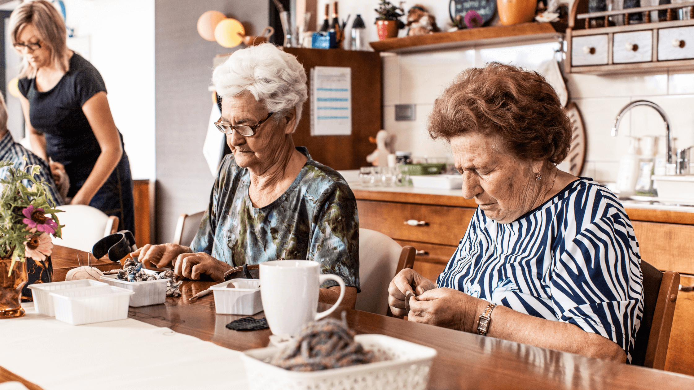 2 older women doing crafts at adult daycare