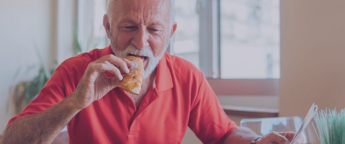 old person eating a snack