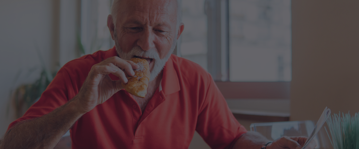 old person eating a snack