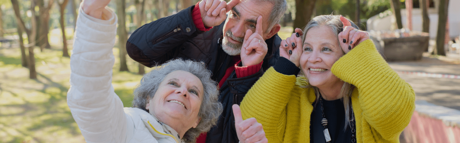 elderly people taking selfies on a tour