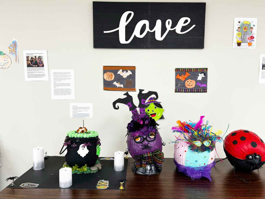 Decorated pumpkins made by members displayed for a seasonal celebration at Penn Village