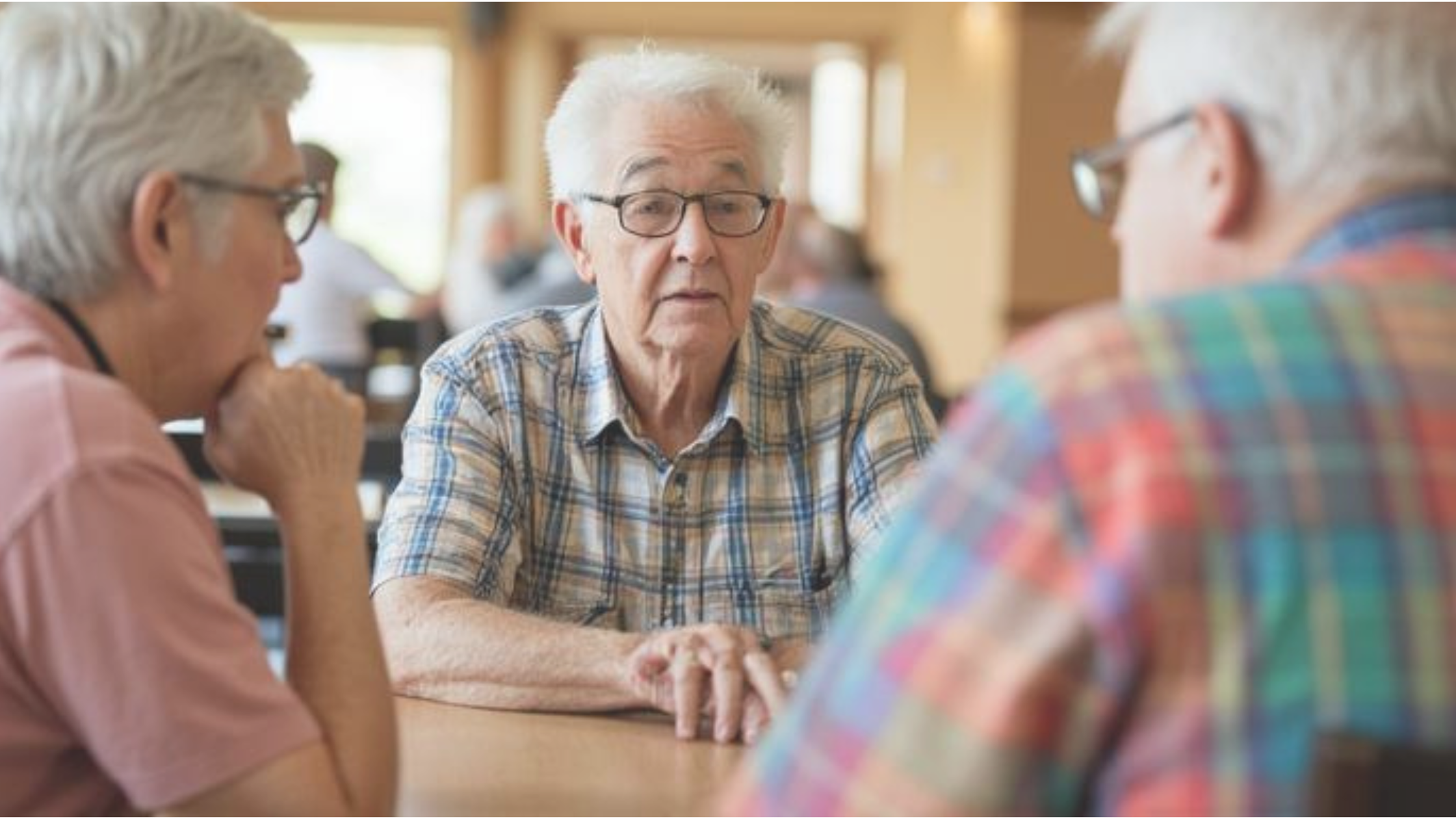 old people at senior center talking to each other